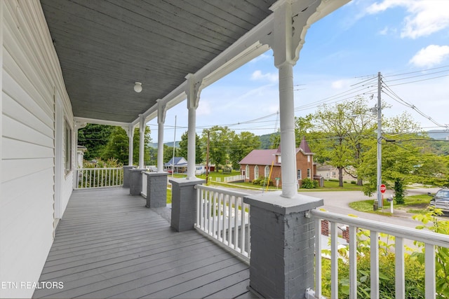 313 W Spring St, Oliver Springs, TN 37840 - wooden terrace with a porch and a residential view