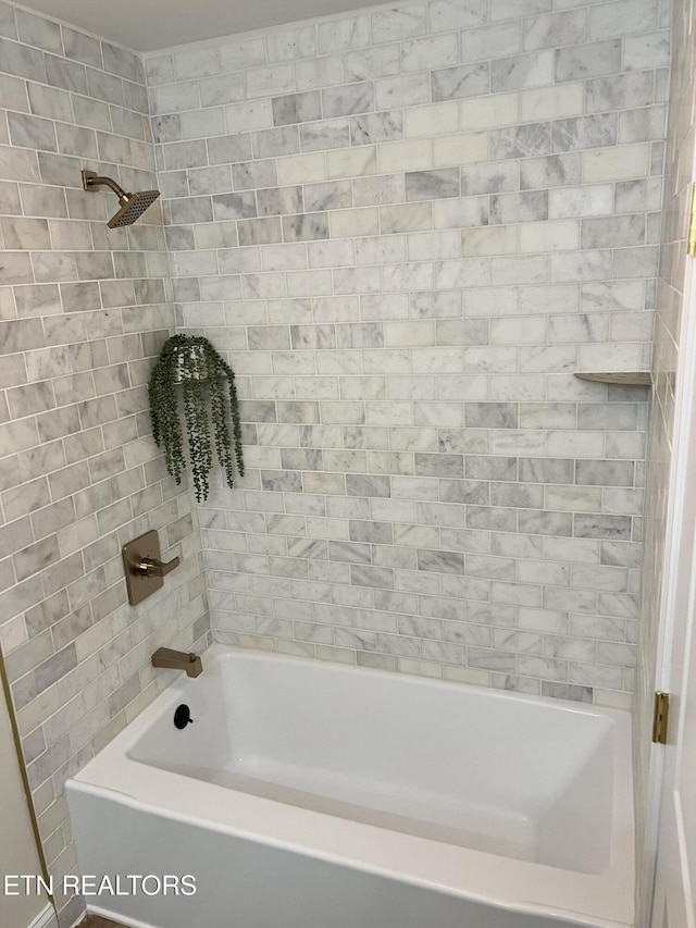 full bath with shower / tub combination