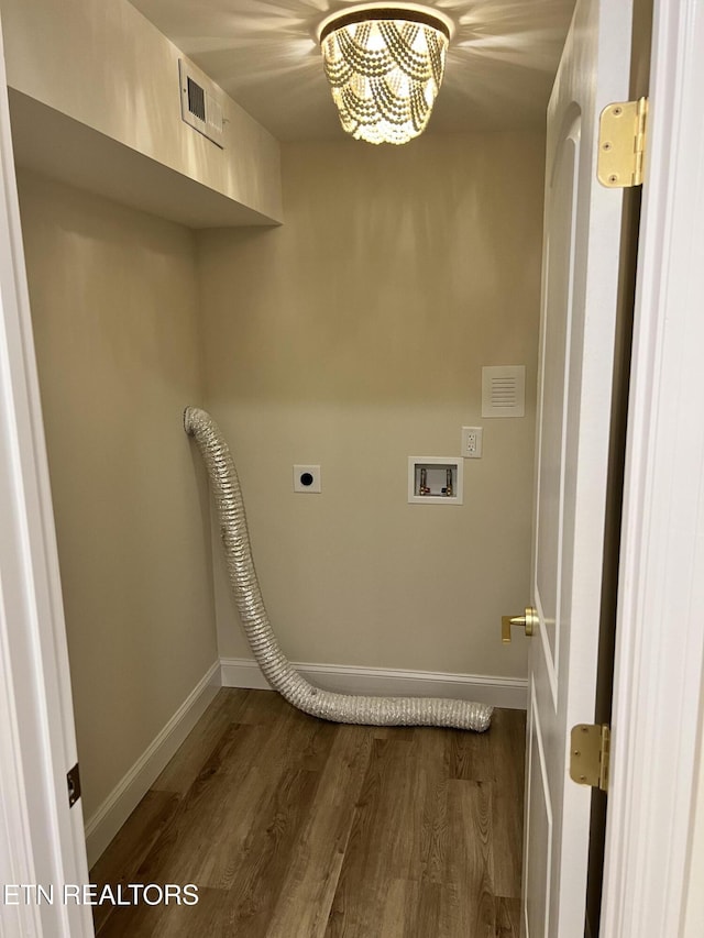 laundry room featuring washer hookup, baseboards, dark wood-type flooring, hookup for an electric dryer, and a chandelier
