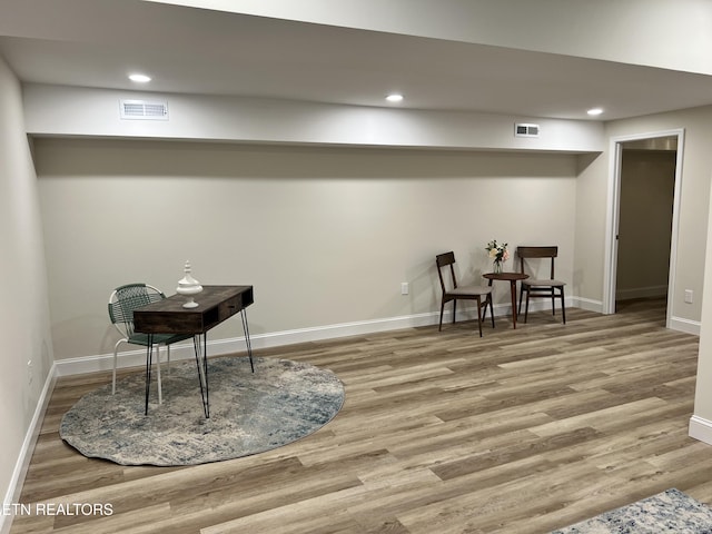 sitting room with wood finished floors, baseboards, and recessed lighting