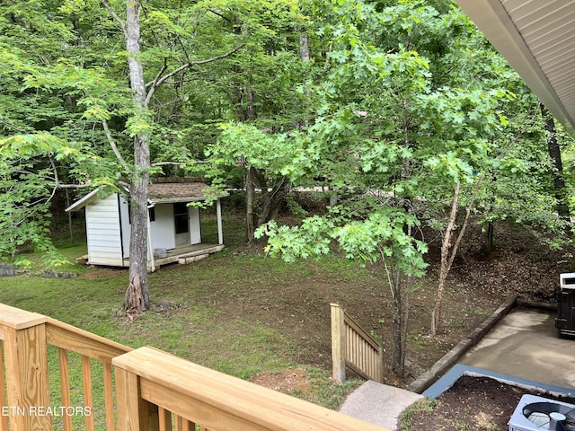 view of yard featuring a shed and an outbuilding