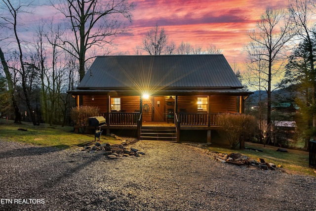 3330 Robeson Rd, Sevierville, TN 37862 - rustic home with a porch and metal roof