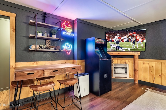 3330 Robeson Rd, Sevierville, TN 37862 - bar area with heating unit, wood finished floors, freestanding refrigerator, wainscoting, and wooden walls