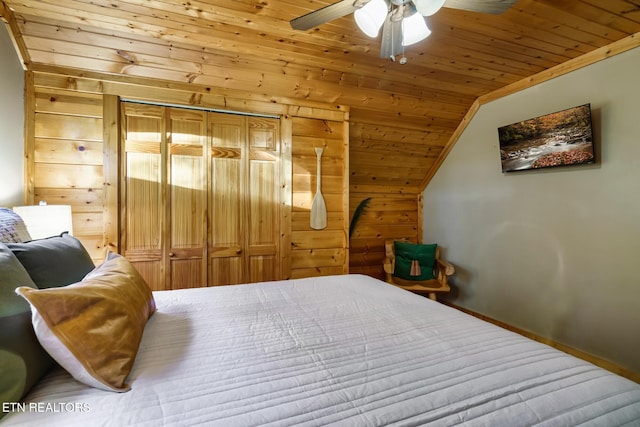 3330 Robeson Rd, Sevierville, TN 37862 - bedroom with wood ceiling, lofted ceiling, baseboards, ceiling fan, and wooden walls