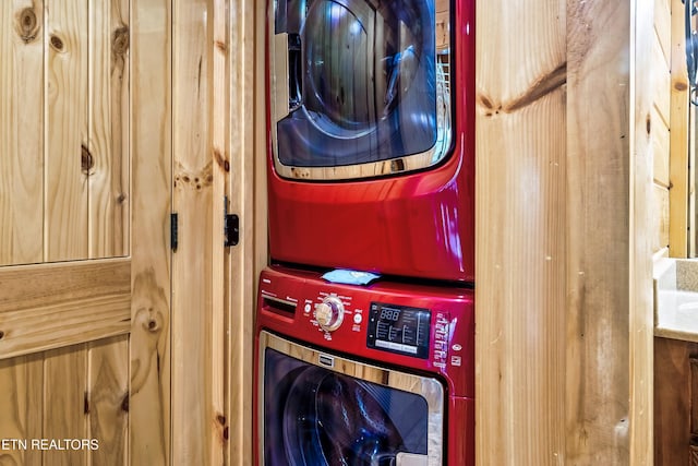 laundry area with stacked washer and clothes dryer