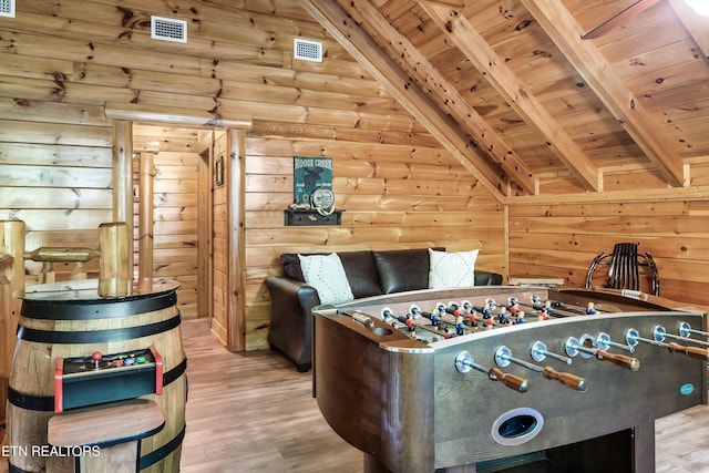 playroom featuring wooden ceiling, wood finished floors, and wood walls