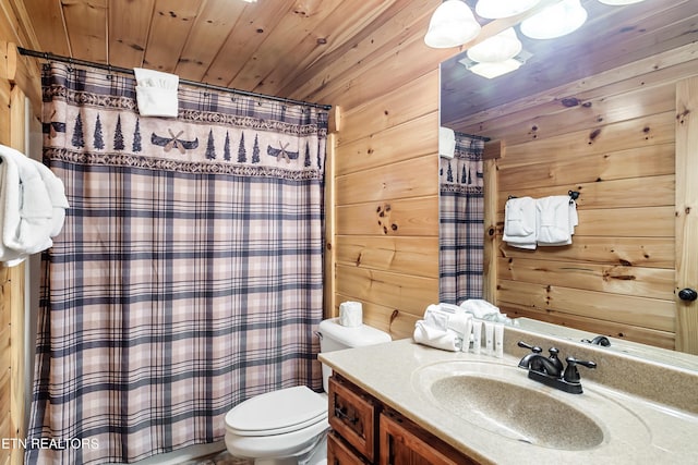 bathroom with vanity, toilet, wooden ceiling, wood walls, and curtained shower