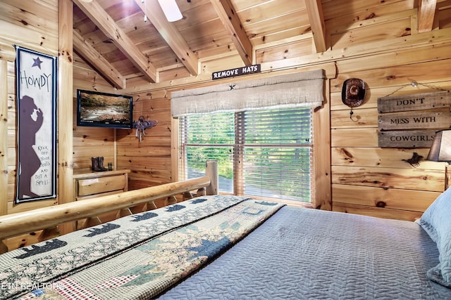 bedroom with wood walls and wooden ceiling