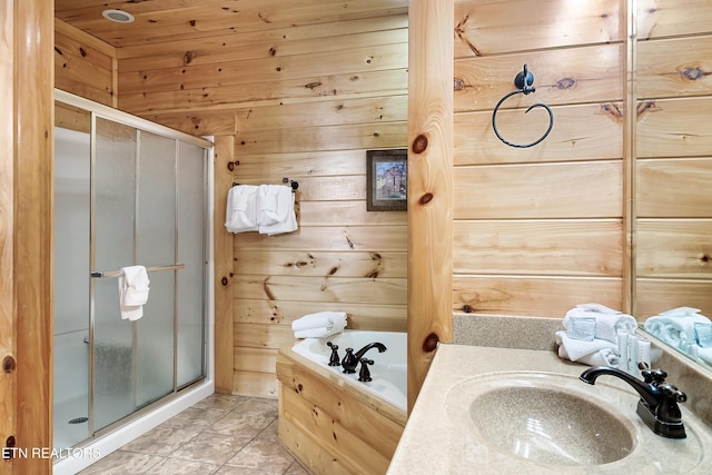 bathroom featuring a sink, a stall shower, wooden walls, a garden tub, and tile patterned floors