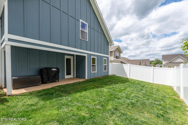 3132 Bakertown Station Way, Knoxville, TN 37931 - back of house with board and batten siding, a fenced backyard, and a patio area