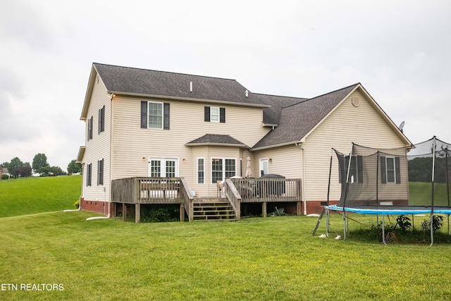 158 Dudley Cir, Tazewell, TN 37879 - rear view of property with a trampoline, a yard, a wooden deck, and crawl space