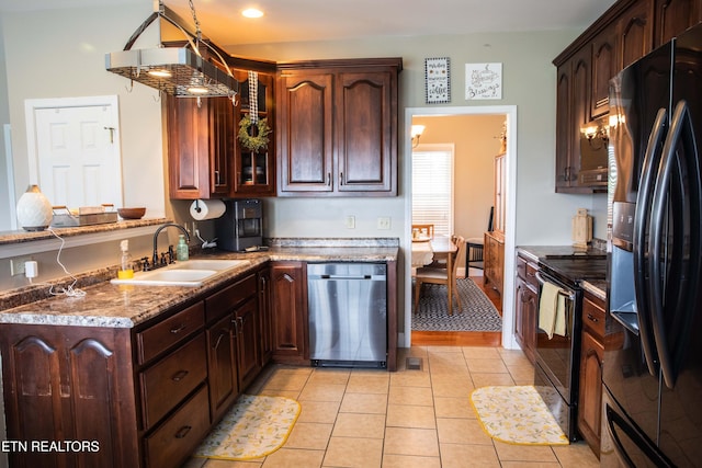 158 Dudley Cir, Tazewell, TN 37879 - kitchen featuring black appliances, a sink, light tile patterned floors, light stone counters, and dark brown cabinetry