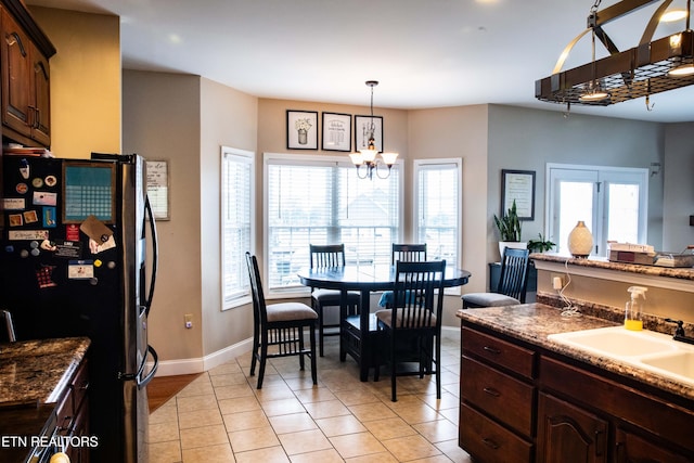158 Dudley Cir, Tazewell, TN 37879 - dining space featuring baseboards, a chandelier, and light tile patterned floors
