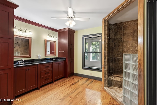 310 Savannah Shores Dr, Delano, TN 37325 - full bathroom with double vanity, wood finished floors, a walk in shower, ceiling fan, and baseboards