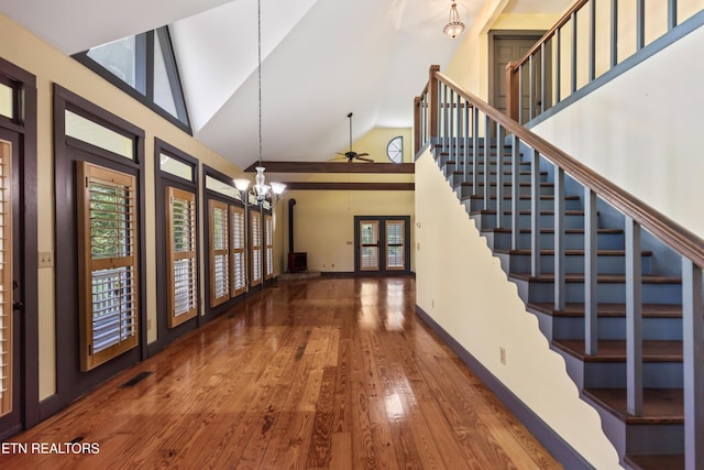 310 Savannah Shores Dr, Delano, TN 37325 - foyer with hardwood / wood-style flooring, high vaulted ceiling, a chandelier, baseboards, and stairway