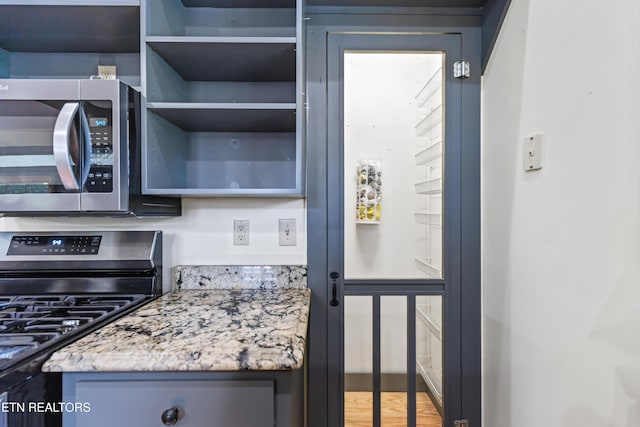 310 Savannah Shores Dr, Delano, TN 37325 - kitchen view of stainless steel appliances and light stone countertops