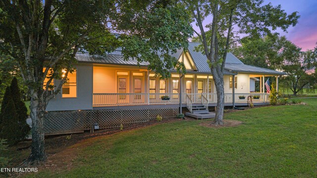 310 Savannah Shores Dr, Delano, TN 37325 - back of property with covered porch, a yard, and metal roof