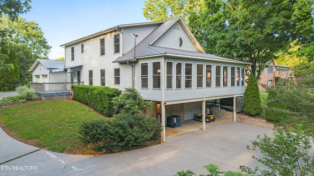 310 Savannah Shores Dr, Delano, TN 37325 - view of front of property featuring a sunroom, a carport, and driveway