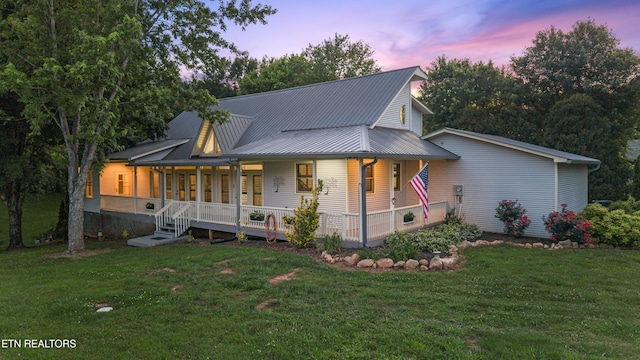 310 Savannah Shores Dr, Delano, TN 37325 - view of front of property with covered porch, a yard, and metal roof