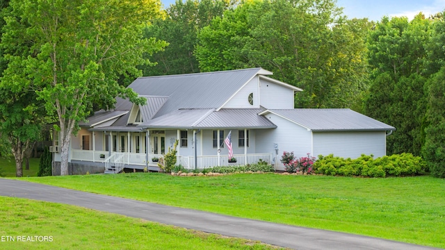 310 Savannah Shores Dr, Delano, TN 37325 - view of front of house with covered porch, metal roof, and a front yard
