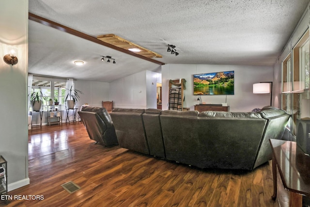 60 Greenview Ln, Crossville, TN 38571 - living area featuring lofted ceiling, wood finished floors, a textured ceiling, and rail lighting