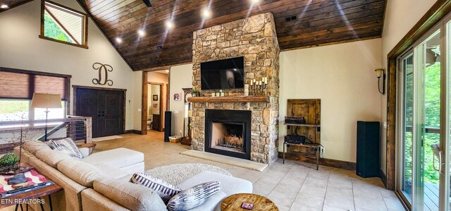 635 Norris Shores Dr, Sharps Chapel, TN 37866 - tiled living area with wood ceiling, a fireplace, high vaulted ceiling, and baseboards