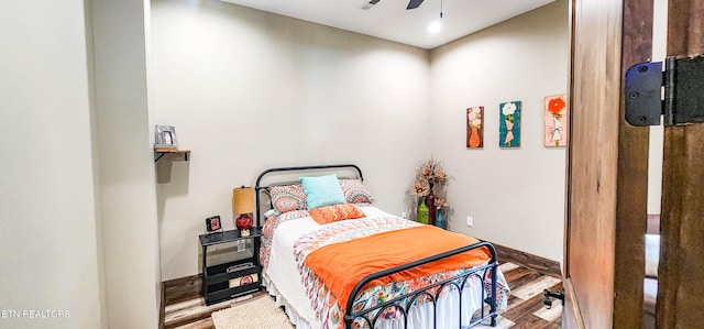 635 Norris Shores Dr, Sharps Chapel, TN 37866 - bedroom featuring wood finished floors, a ceiling fan, and baseboards
