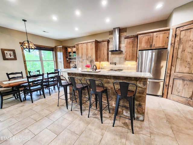 635 Norris Shores Dr, Sharps Chapel, TN 37866 - kitchen featuring wall chimney exhaust hood, stainless steel appliances, a breakfast bar area, recessed lighting, and decorative backsplash