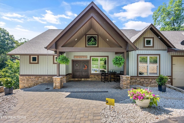 635 Norris Shores Dr, Sharps Chapel, TN 37866 - view of front of house with a shingled roof, stone siding, and board and batten siding