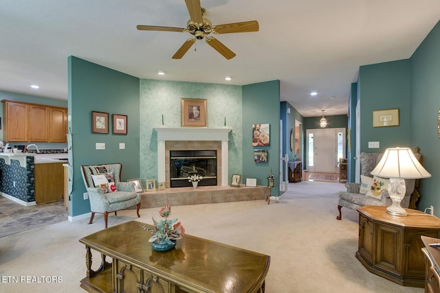 307 Okmulgee Cir, Loudon, TN 37774 - living room with light colored carpet, a ceiling fan, a tile fireplace, and recessed lighting