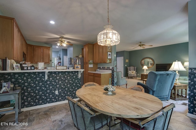 307 Okmulgee Cir, Loudon, TN 37774 - dining room with a ceiling fan, a chandelier, and baseboards