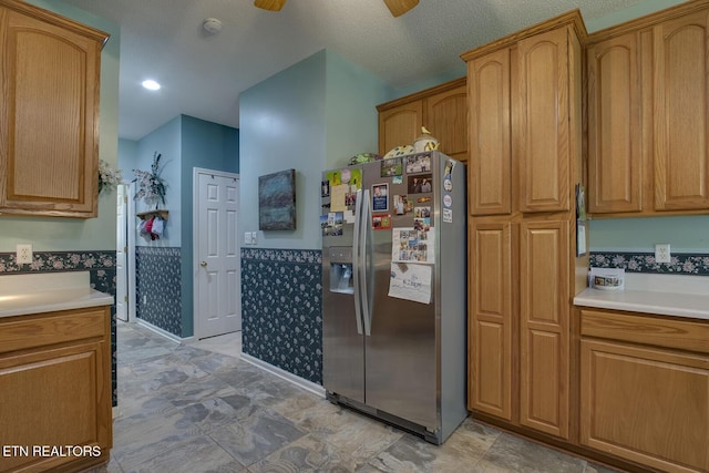 307 Okmulgee Cir, Loudon, TN 37774 - kitchen featuring stainless steel refrigerator with ice dispenser, a wainscoted wall, light countertops, and brown cabinetry