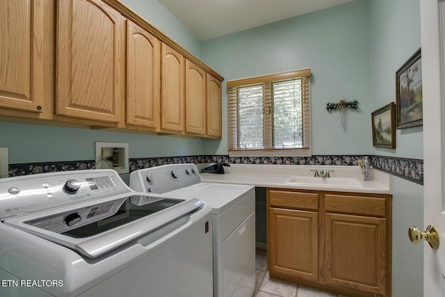 307 Okmulgee Cir, Loudon, TN 37774 - laundry room featuring independent washer and dryer, cabinet space, and light tile patterned floors