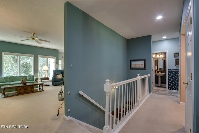307 Okmulgee Cir, Loudon, TN 37774 - hallway featuring an upstairs landing, carpet, recessed lighting, and baseboards