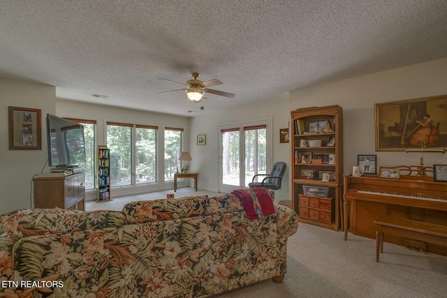 307 Okmulgee Cir, Loudon, TN 37774 - carpeted living room featuring a ceiling fan and a textured ceiling