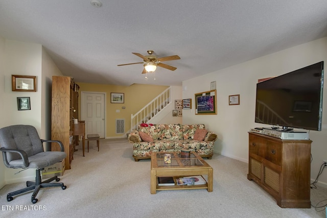 307 Okmulgee Cir, Loudon, TN 37774 - living area featuring a ceiling fan, stairs, light colored carpet, and baseboards