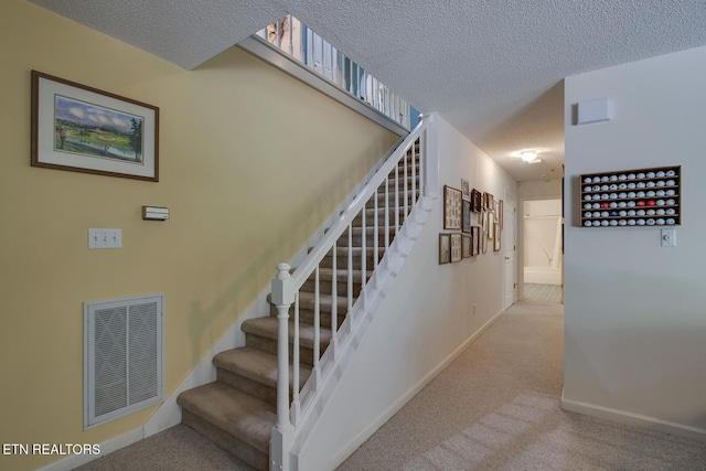 307 Okmulgee Cir, Loudon, TN 37774 - stairway featuring carpet, baseboards, and a textured ceiling