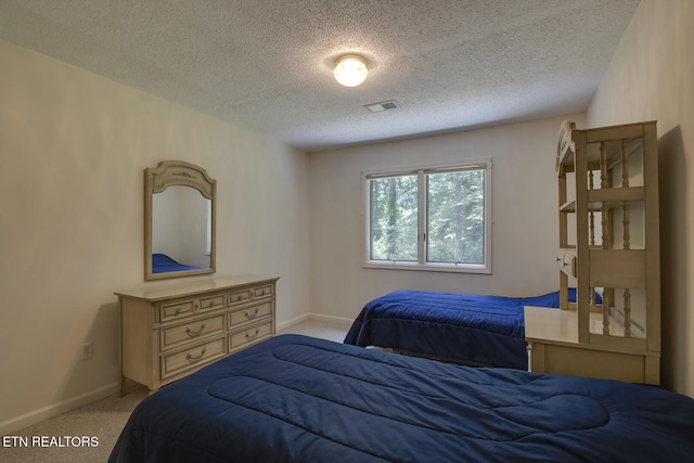 307 Okmulgee Cir, Loudon, TN 37774 - bedroom with light carpet, a textured ceiling, and baseboards