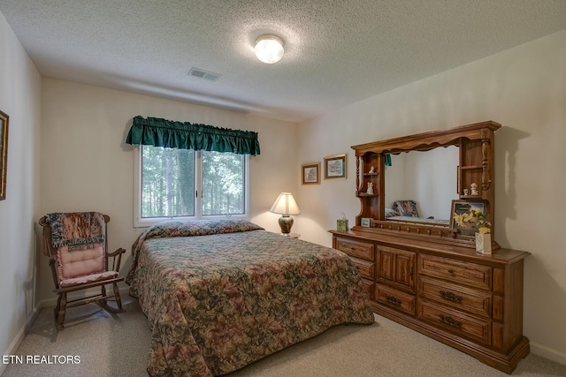 307 Okmulgee Cir, Loudon, TN 37774 - bedroom featuring light carpet, a textured ceiling, and baseboards
