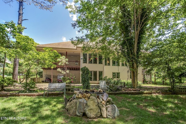 307 Okmulgee Cir, Loudon, TN 37774 - back of house featuring a balcony and a lawn