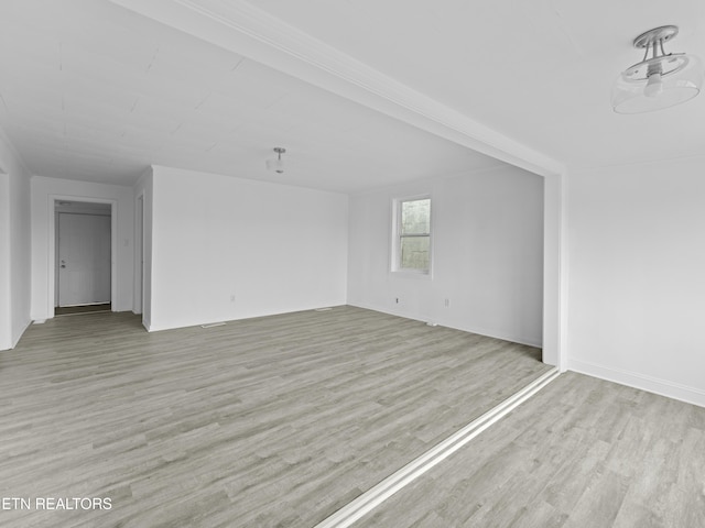 1245 Virginia Ave, Knoxville, TN 37921 - unfurnished living room with light wood-style flooring and baseboards