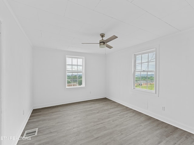 1245 Virginia Ave, Knoxville, TN 37921 - unfurnished room with wood finished floors, ceiling fan, baseboards, and ornamental molding