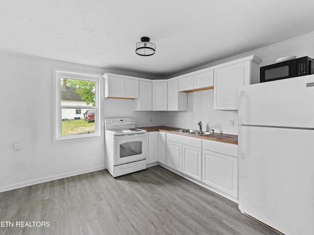 1245 Virginia Ave, Knoxville, TN 37921 - kitchen with white appliances, a sink, light wood-type flooring, and white cabinetry