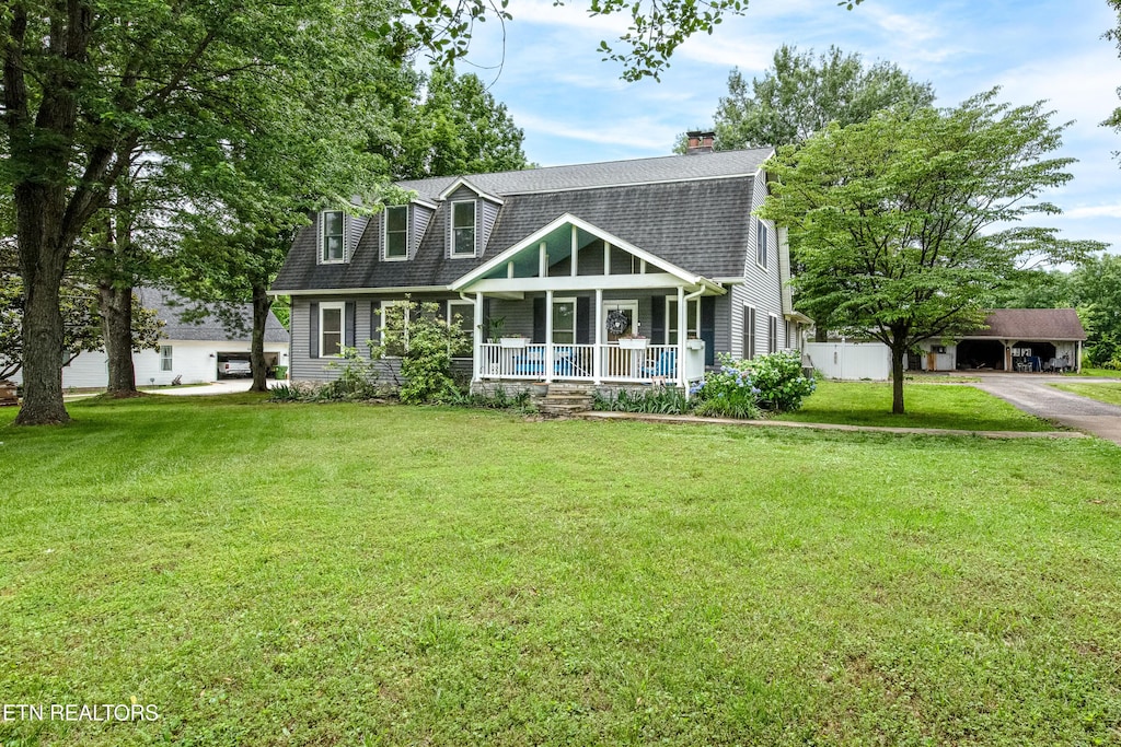 209 Montgomery Ln, Maryville, TN 37803 - view of front of home with covered porch, roof with shingles, a front yard, and a chimney
