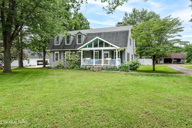 209 Montgomery Ln, Maryville, TN 37803 - view of front of home with covered porch, roof with shingles, a front yard, and a chimney