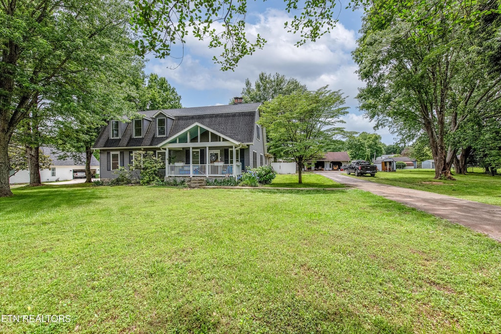 209 Montgomery Ln, Maryville, TN 37803 - view of front of home featuring covered porch, a front lawn, a chimney, driveway, and a shingled roof