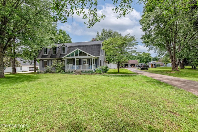 209 Montgomery Ln, Maryville, TN 37803 - view of front of home featuring covered porch, a front lawn, a chimney, driveway, and a shingled roof
