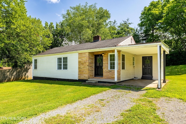 409 Melrose St, Maryville, TN 37803 - view of front of house featuring driveway, a chimney, and a carport