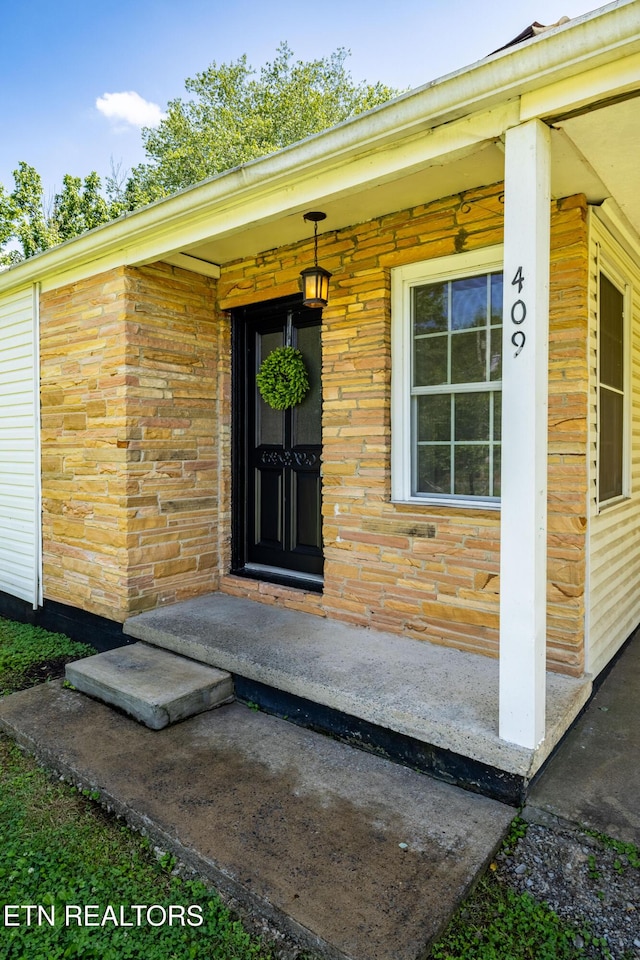 409 Melrose St, Maryville, TN 37803 - doorway to property featuring brick siding and a porch