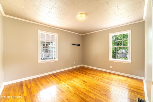 714 E Emerald Ave, Knoxville, TN 37917 - spare room with ornamental molding, light wood-style floors, and baseboards